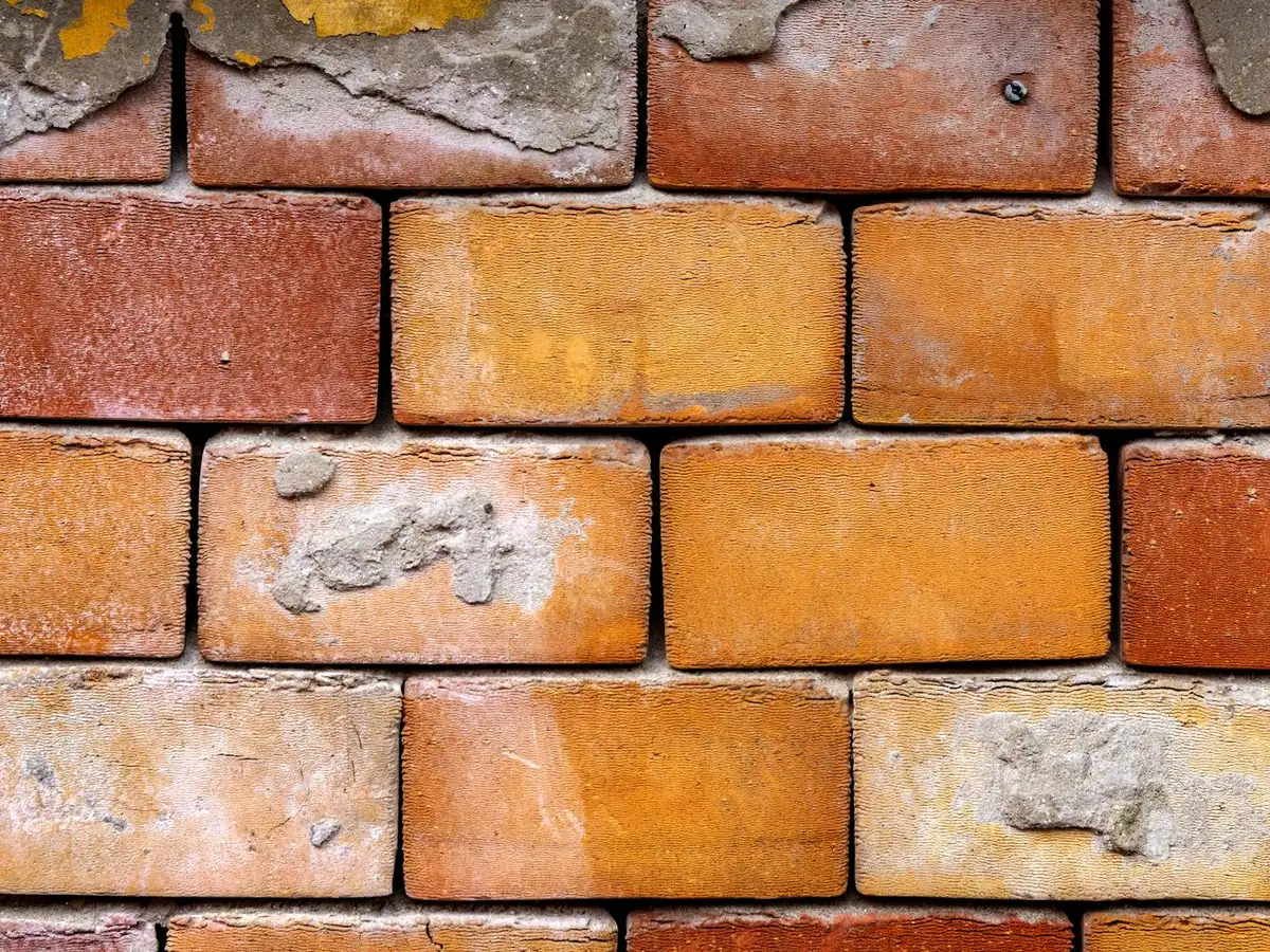 Restored brick wall with neat, matched mortar joints.