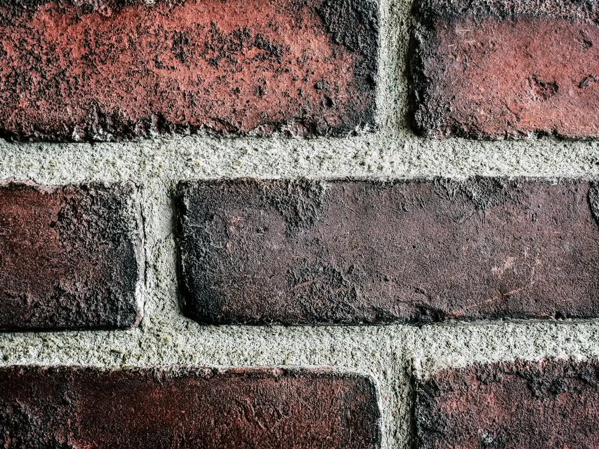 Brick wall with clean, even, tooled mortar joints.