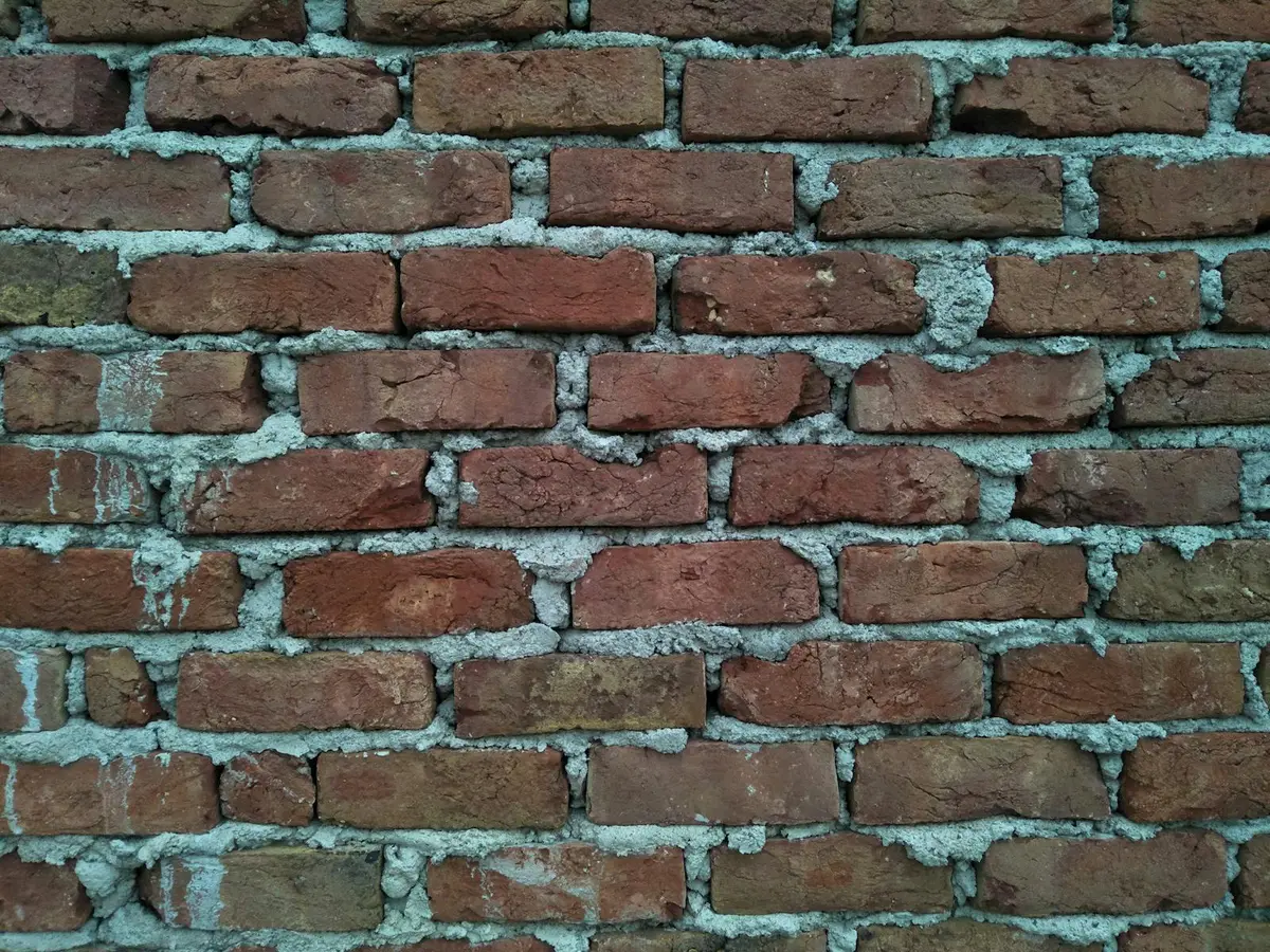 Brick wall with clean, even, tooled mortar joints.