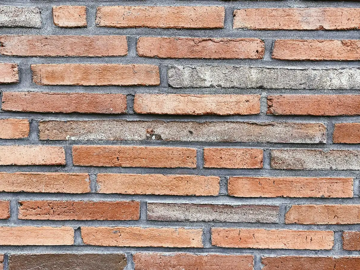 Brick wall with clean, even, tooled mortar joints.